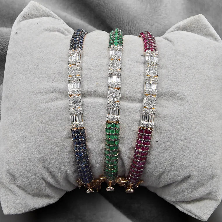 Emerald, sapphire and ruby bangles by Huma Jewellers