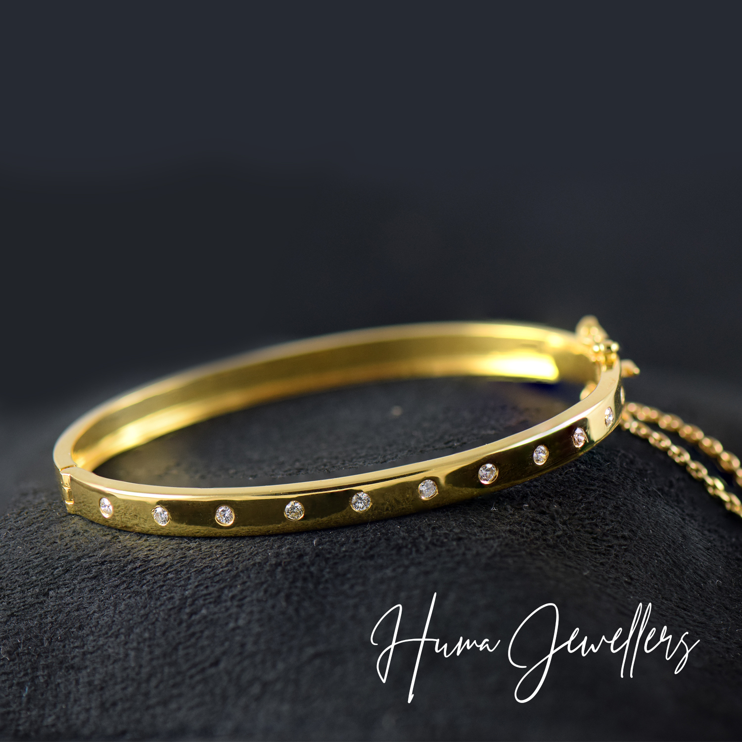 simple delicate classic diamond bracelet design with round diamonds in 18 karat gold by huma jewellers karachi pakistan